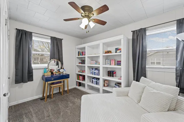 a bedroom with a bed furniture and a window