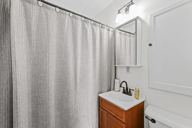 a bathroom with a sink a vanity and a mirror