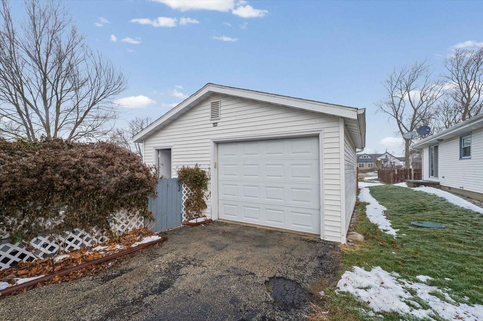 310 East Main Street Buckley, IL 60918 - Photo 23 of 28 a front view of a house with a yard and garage