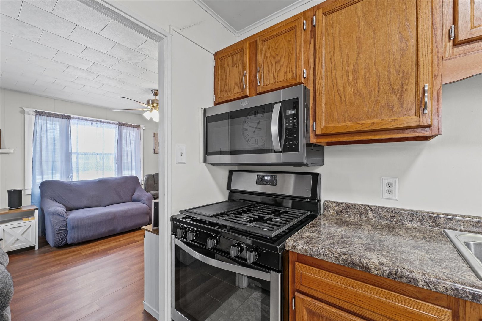 310 East Main Street Buckley, IL 60918 - Photo 10 of 28 a kitchen with wooden cabinets and a stove top oven