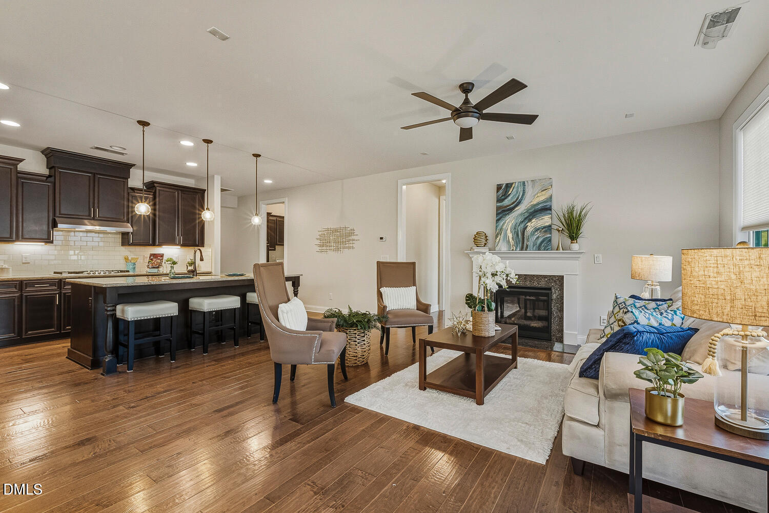1025 Nickelby Street Durham, NC 27703 - Photo 16 of 71 a living room with furniture kitchen view and a fireplace