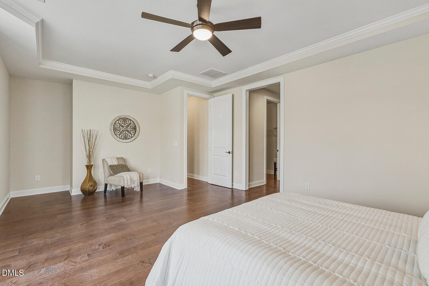 1025 Nickelby Street Durham, NC 27703 - Photo 33 of 71 a bedroom with a bed and a chandelier