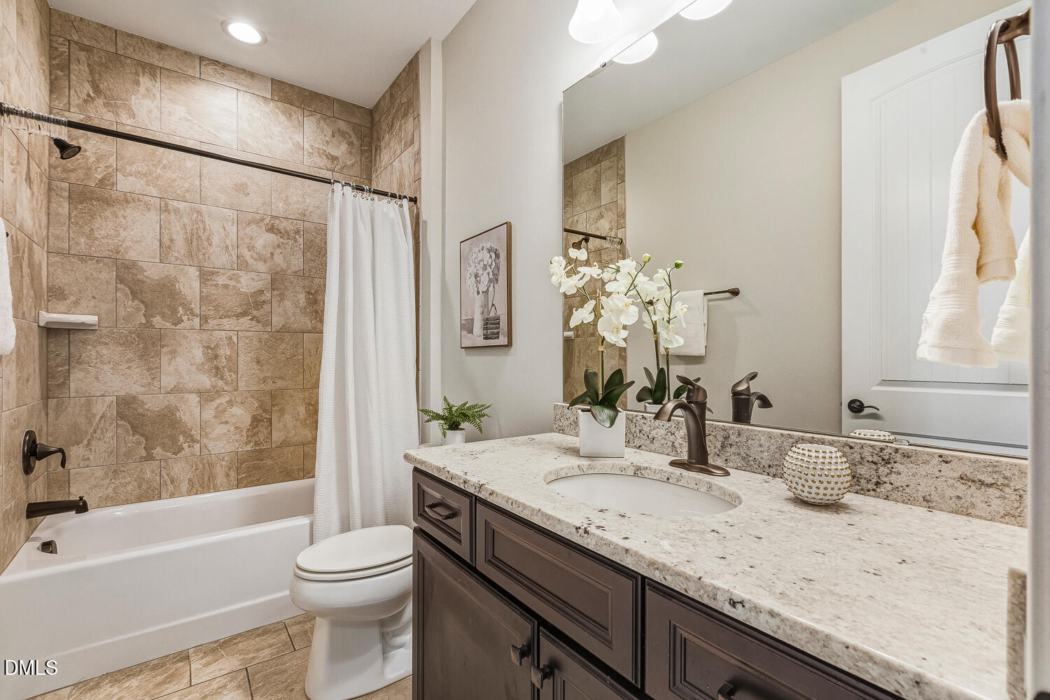 1025 Nickelby Street Durham, NC 27703 - Photo 51 of 71 a bathroom with a granite countertop sink toilet and shower