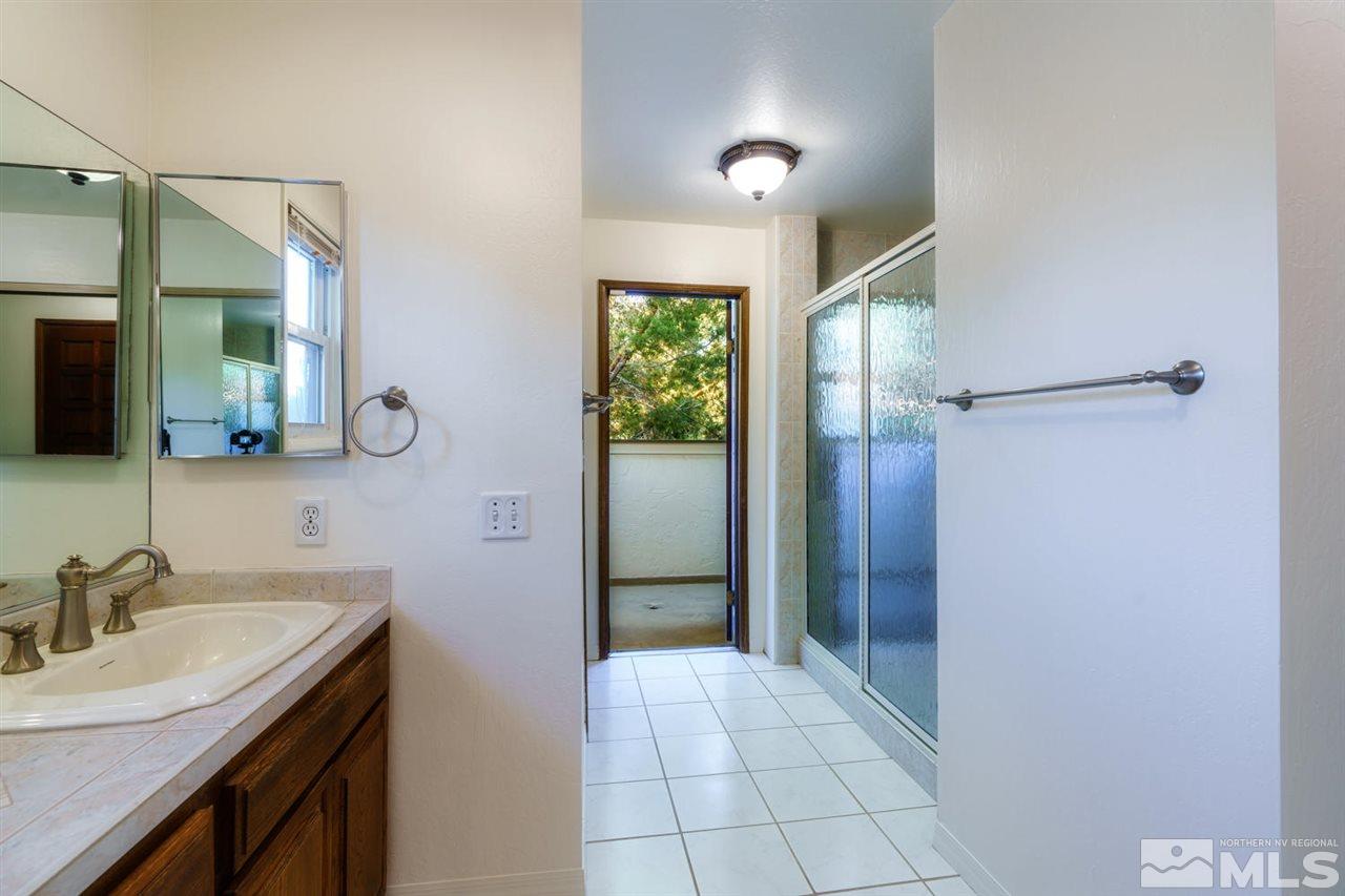 465 Anne Marie Court Reno, NV 89509 - Photo 17 of 21 a bathroom with a sink and a mirror