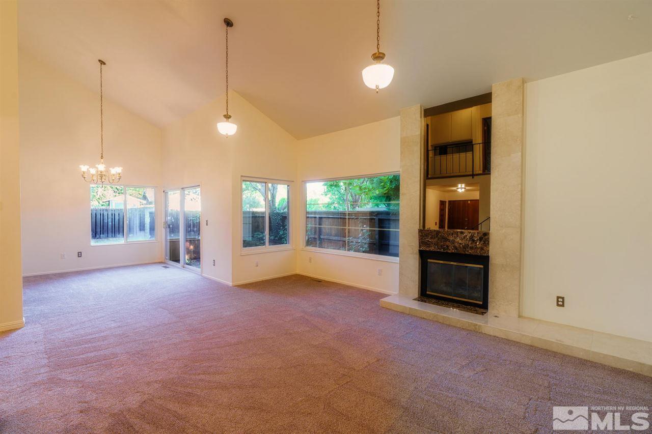 465 Anne Marie Court Reno, NV 89509 - Photo 6 of 21 a view of a room with floor to ceiling window and kitchen view