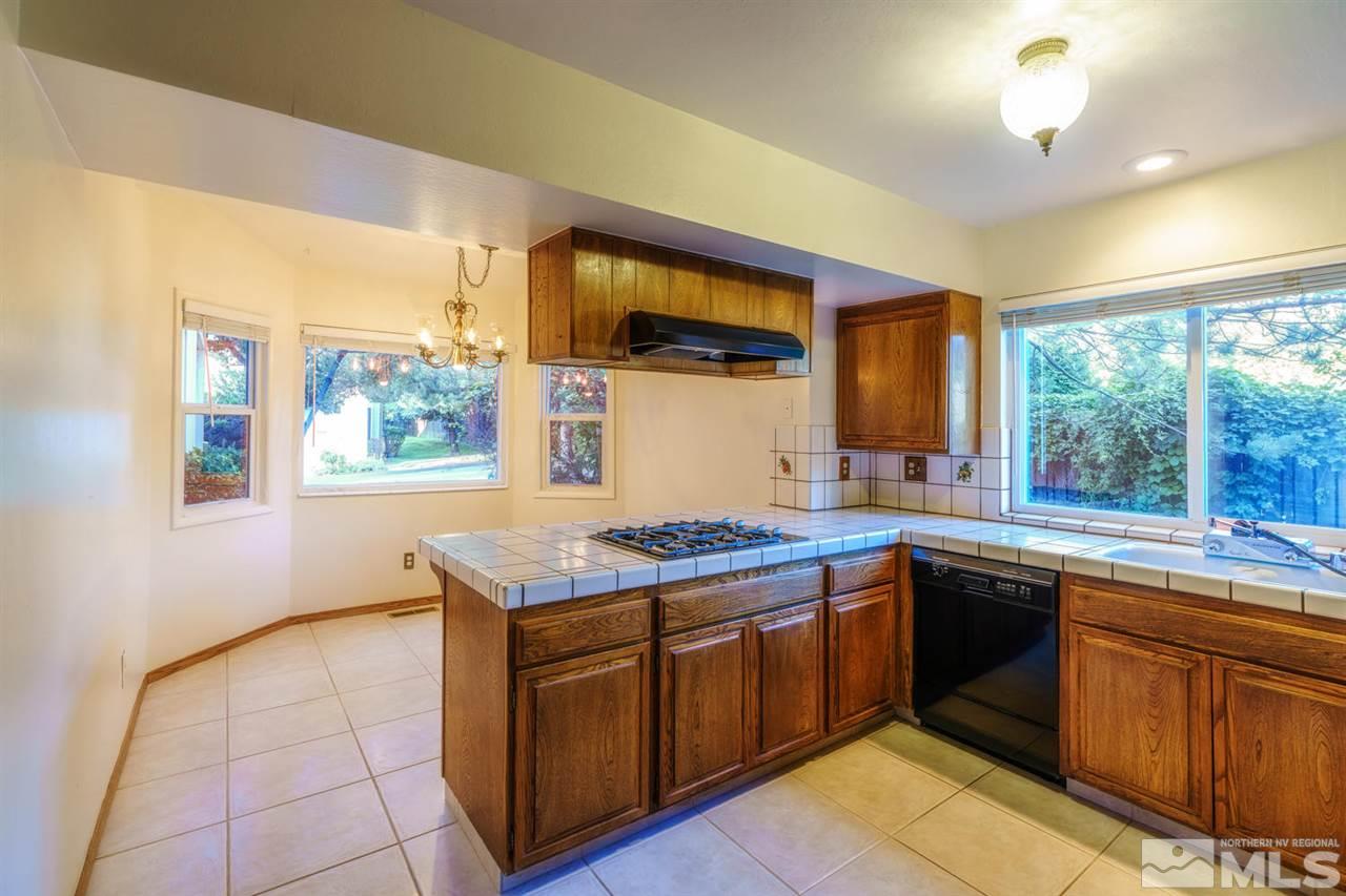 465 Anne Marie Court Reno, NV 89509 - Photo 9 of 21 a kitchen with a sink stove and cabinets