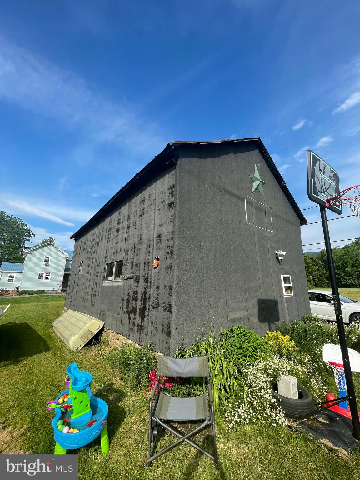 5035 Back Maitland Road McClure, PA 17841 - Photo 15 of 28 a backyard of a house with lots of green space and outdoor seating