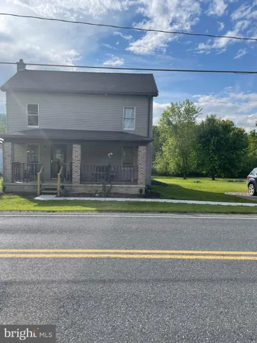 a view of building with a swimming pool and outdoor space
