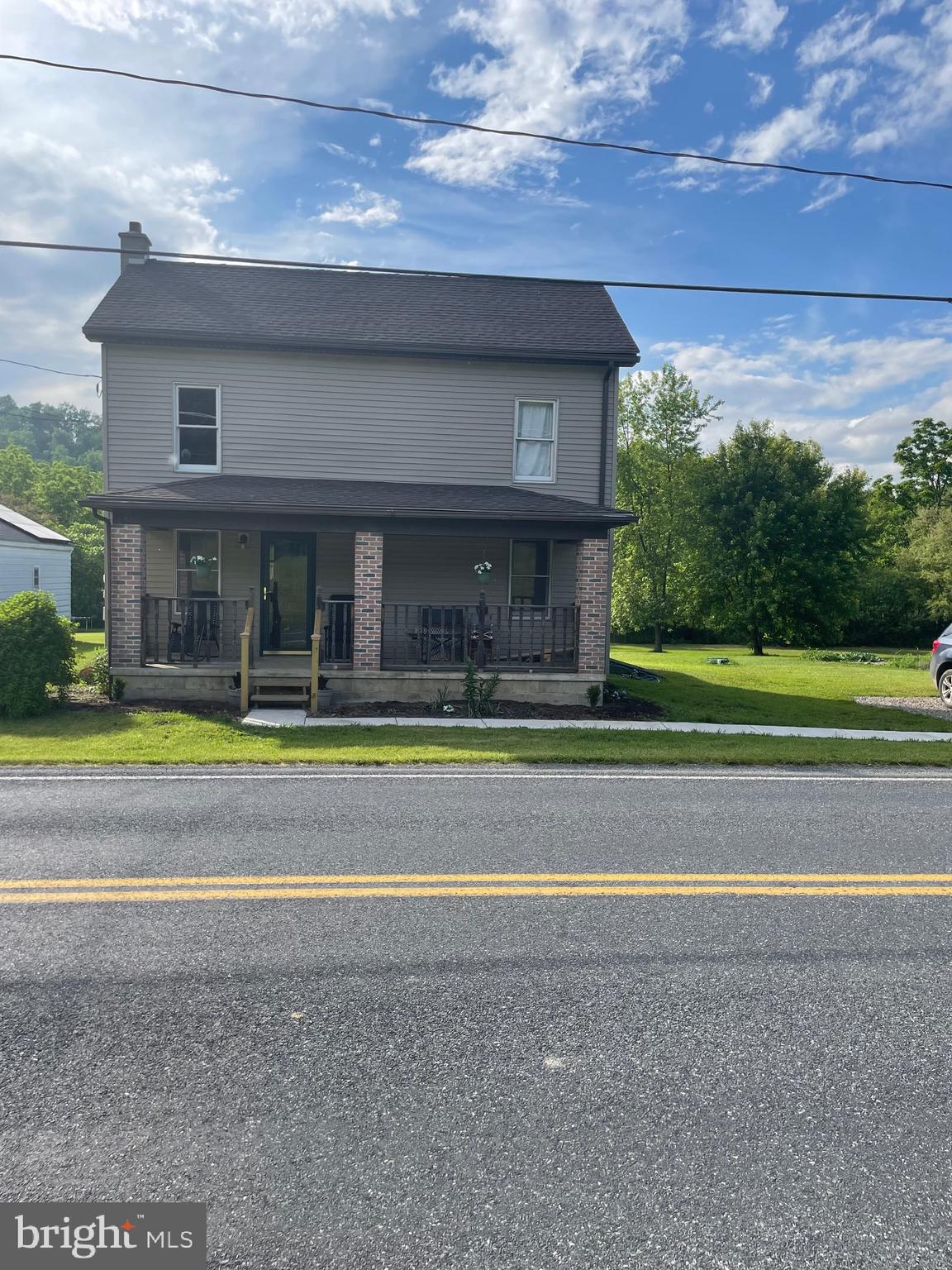 5035 Back Maitland Road McClure, PA 17841 - Photo 2 of 28 a view of swimming pool with lawn chairs and large trees