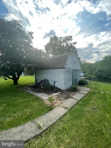 a bathroom with a toilet and a mirror