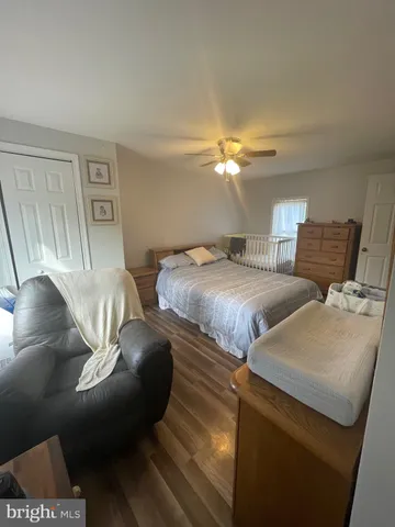 a bedroom with two beds and a chandelier