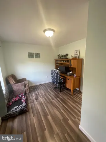 a bedroom with a bed and a desk