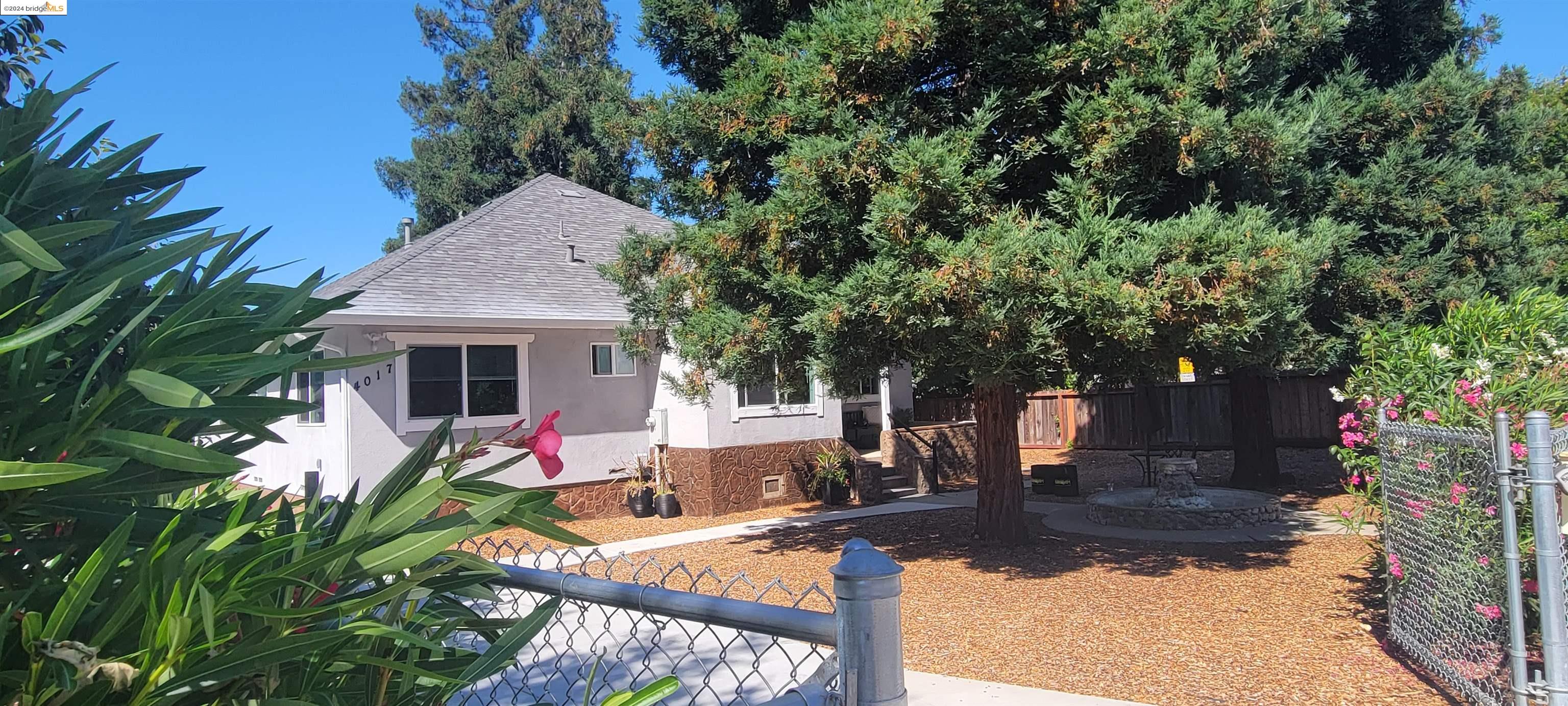 4017 Stanley Boulevard Pleasanton, CA 94566 - Photo 1 of 1 a front view of house with yard outdoor seating and green space