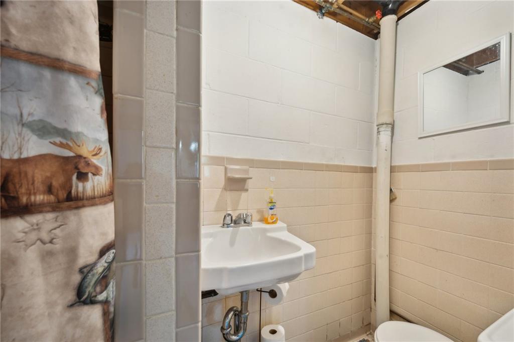 1213 Lower Mateer Road Vandergrift, PA 15690 - Photo 21 of 28 a bathroom with a sink and a mirror
