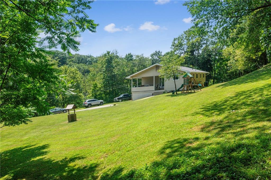 1213 Lower Mateer Road Vandergrift, PA 15690 - Photo 23 of 28 a house view with a garden space