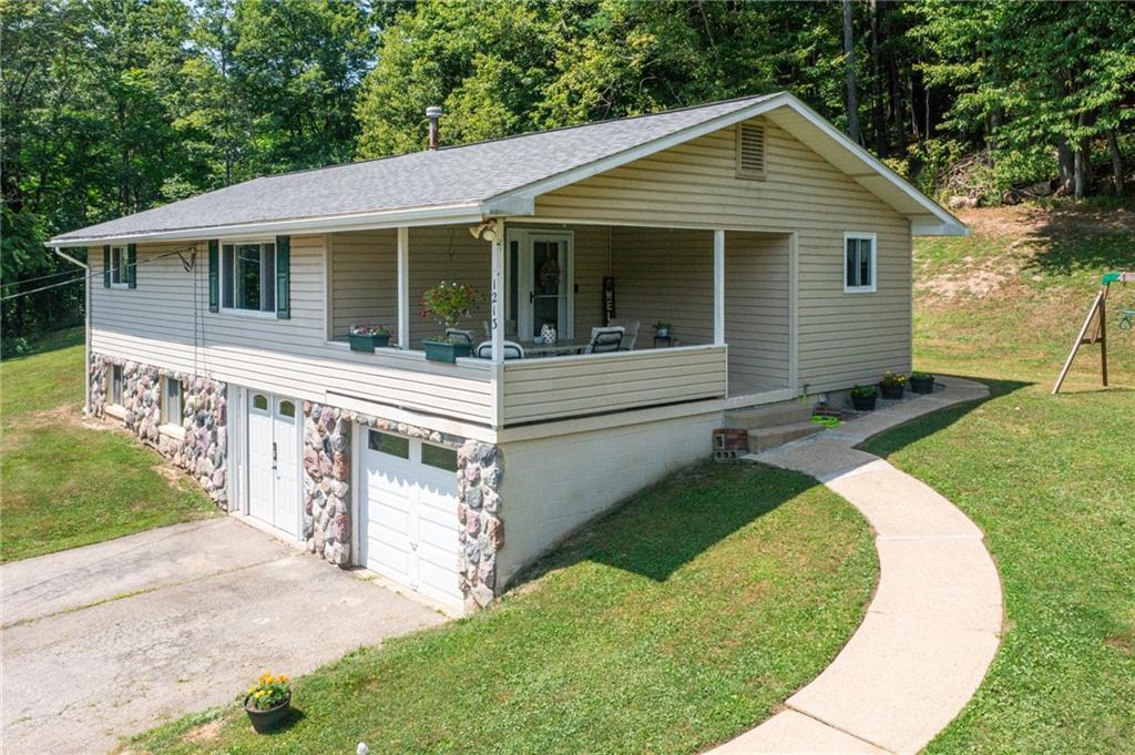 1213 Lower Mateer Road Vandergrift, PA 15690 - Photo 25 of 28 a front view of a house with a yard