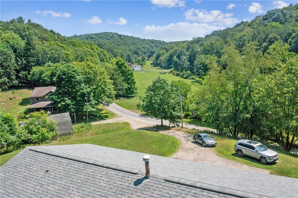 1213 Lower Mateer Road Vandergrift, PA 15690 - Photo 27 of 28 a view of a garden with a slide