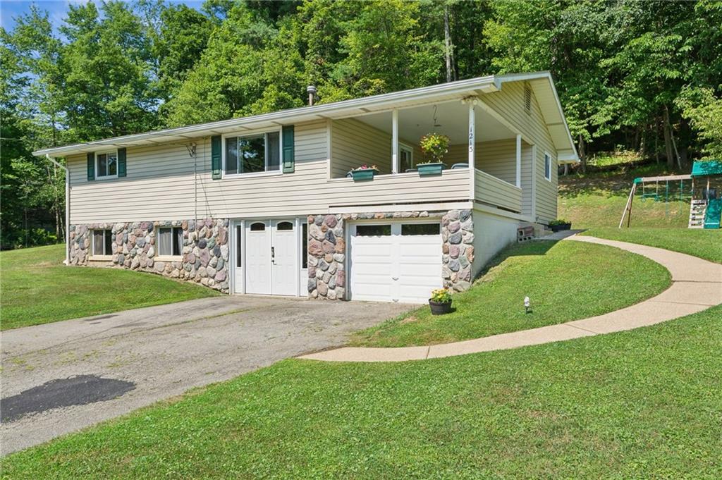 1213 Lower Mateer Road Vandergrift, PA 15690 - Photo 28 of 28 a view of a house with a yard and sitting area