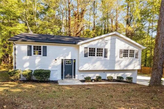 a front view of a house with a yard