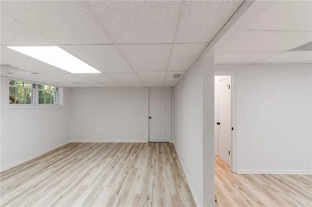 a view of a room with wooden floor