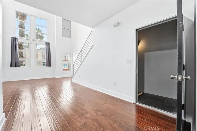a kitchen with stainless steel appliances a refrigerator and a stove top oven