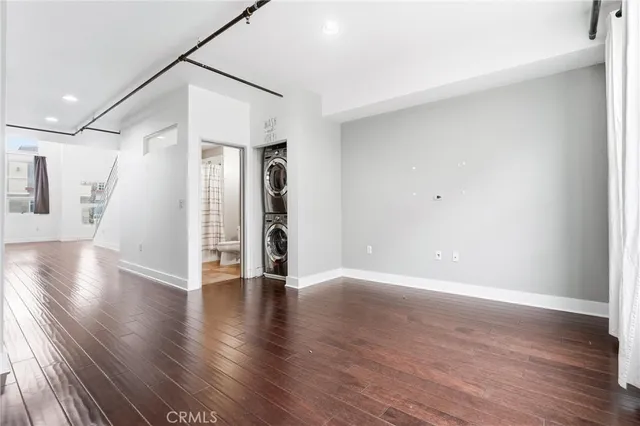 a view of a kitchen with wooden floor