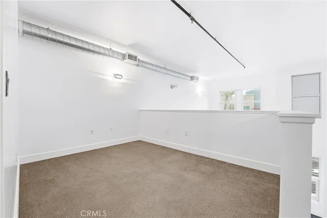 a view of a room that has a window