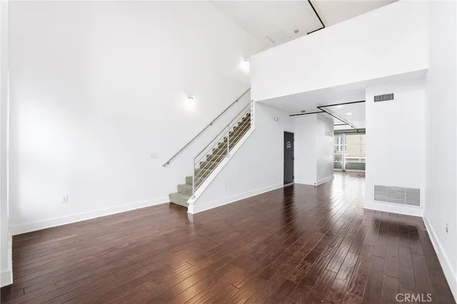 a view of an entryway with wooden floor