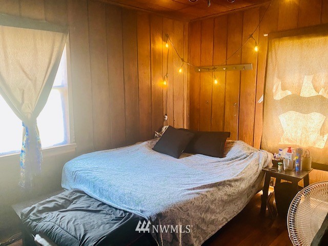 171 Poetsch Road Toledo, WA 98591 - Photo 12 of 23 a bedroom with a bed and wooden floor