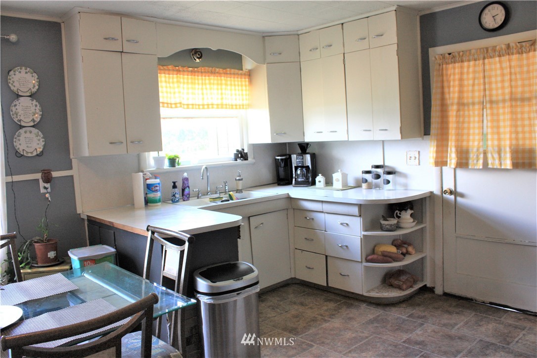 171 Poetsch Road Toledo, WA 98591 - Photo 6 of 23 a utility room with cabinets washer and dryer