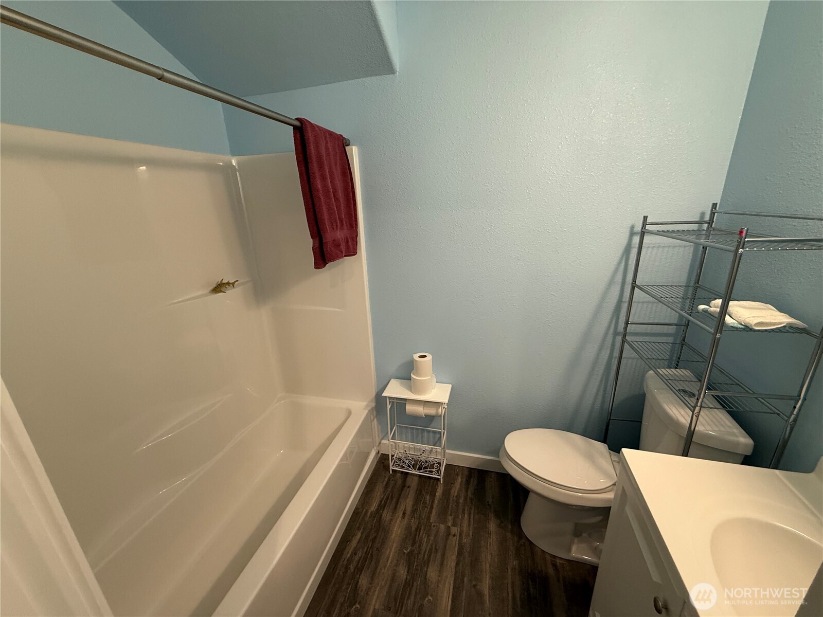 505 Beach Street Pateros, WA 98846 - Photo 11 of 36 a white toilet sitting next to a bath tub and a shower
