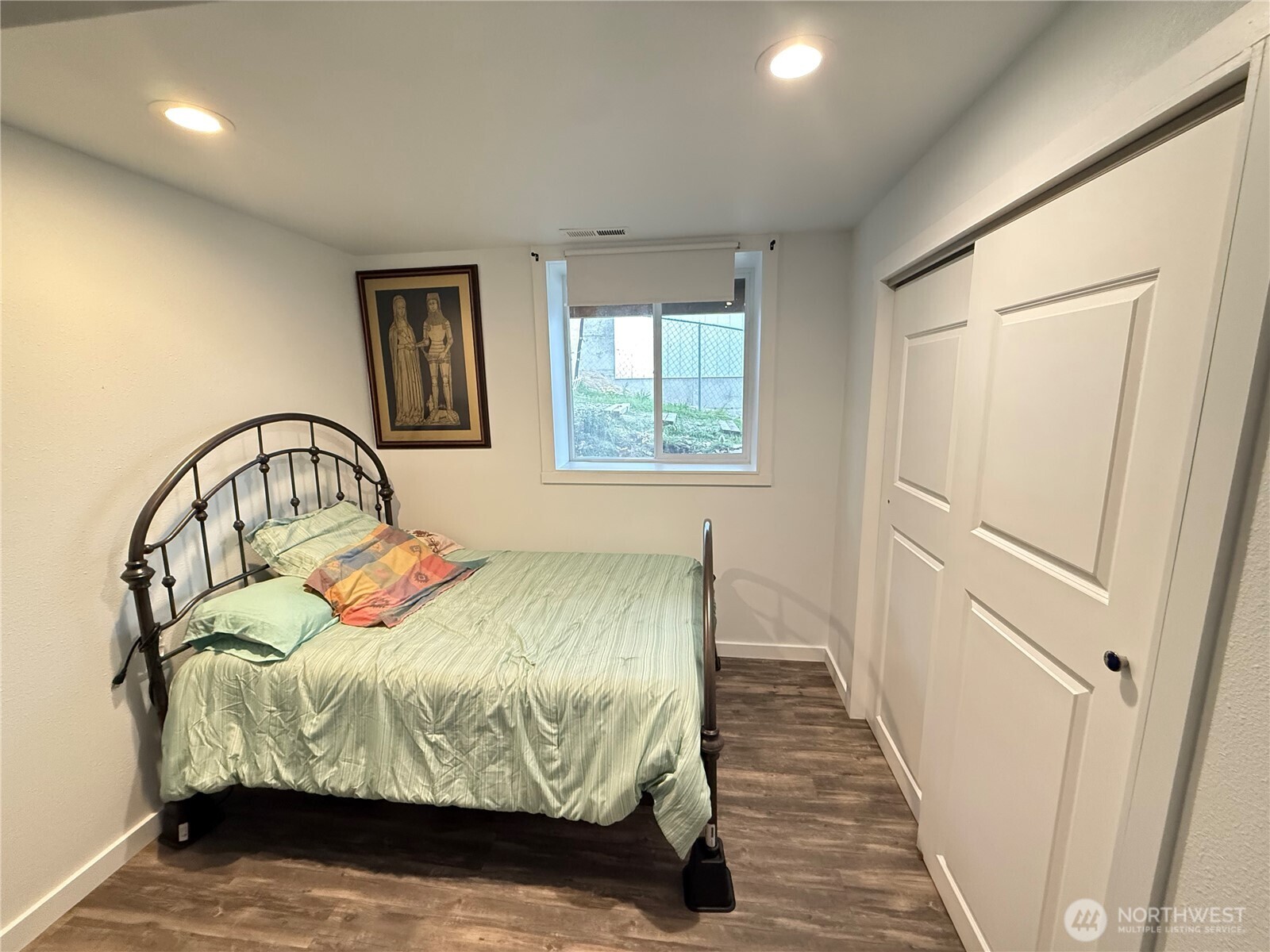 505 Beach Street Pateros, WA 98846 - Photo 14 of 36 a bedroom with a bed and wooden floor