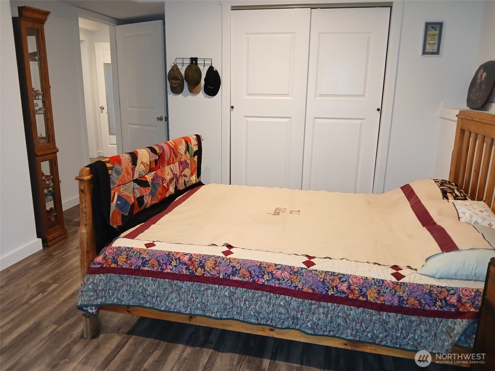 505 Beach Street Pateros, WA 98846 - Photo 23 of 36 a bed sitting in a bedroom next to a window with dresser