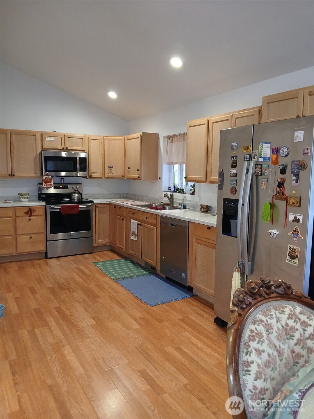 505 Beach Street Pateros, WA 98846 - Photo 34 of 36 a kitchen with stainless steel appliances granite countertop a stove top oven a sink dishwasher and a refrigerator