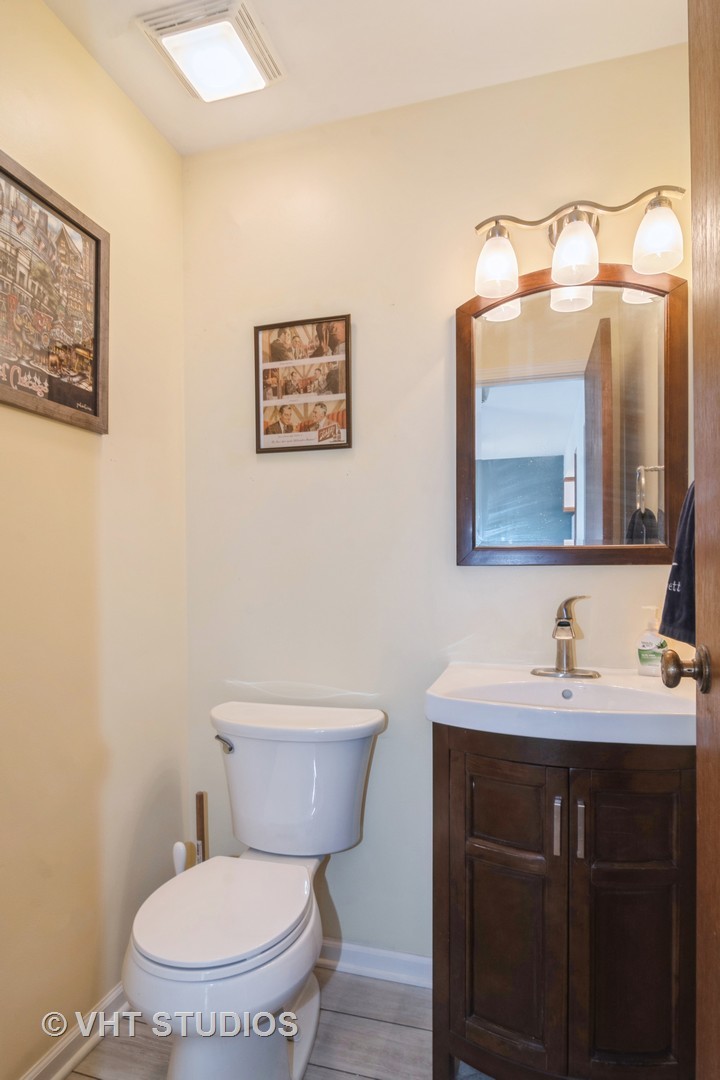 4S768 Pinehurst Drive Naperville, IL 60563 - Photo 12 of 21 a bathroom with a toilet a sink and mirror