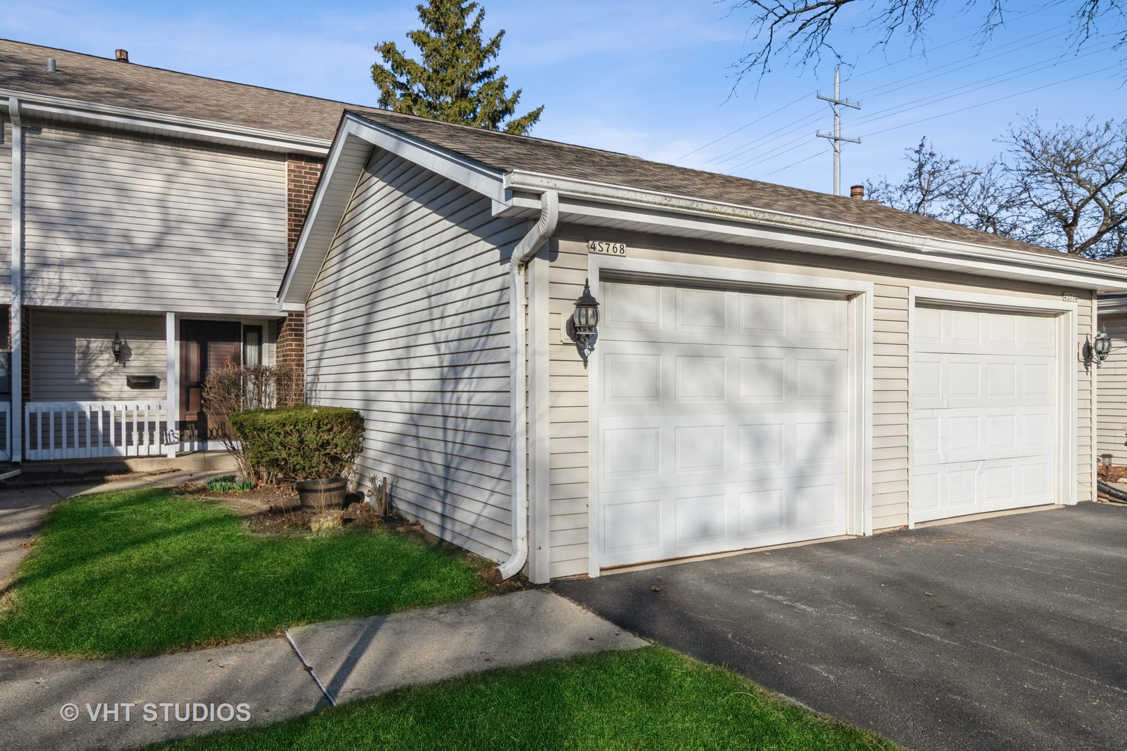 4S768 Pinehurst Drive Naperville, IL 60563 - Photo 2 of 21 a front view of a house with a garden and plants