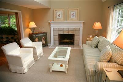 32 Meadowbrook Road Mashpee, MA 02649 - Photo 3 of 16 a living room with furniture and a fireplace