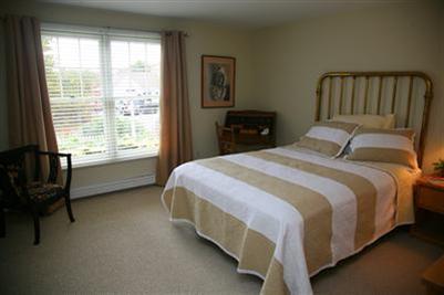 32 Meadowbrook Road Mashpee, MA 02649 - Photo 8 of 16 a bedroom with a bed and a window