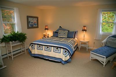 32 Meadowbrook Road Mashpee, MA 02649 - Photo 9 of 16 a bedroom with a bed and a window