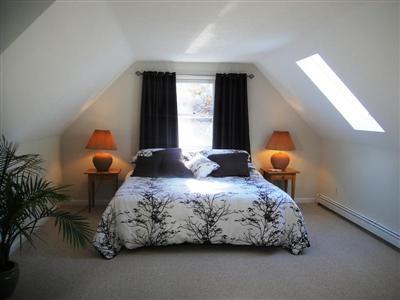 32 Meadowbrook Road Mashpee, MA 02649 - Photo 10 of 16 a bedroom with a bed and window