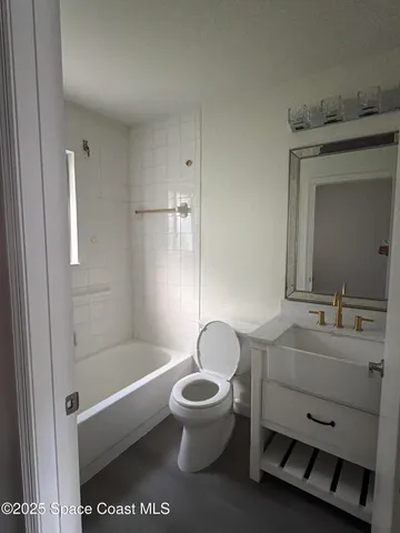 a bathroom with a toilet a sink and a bathtub