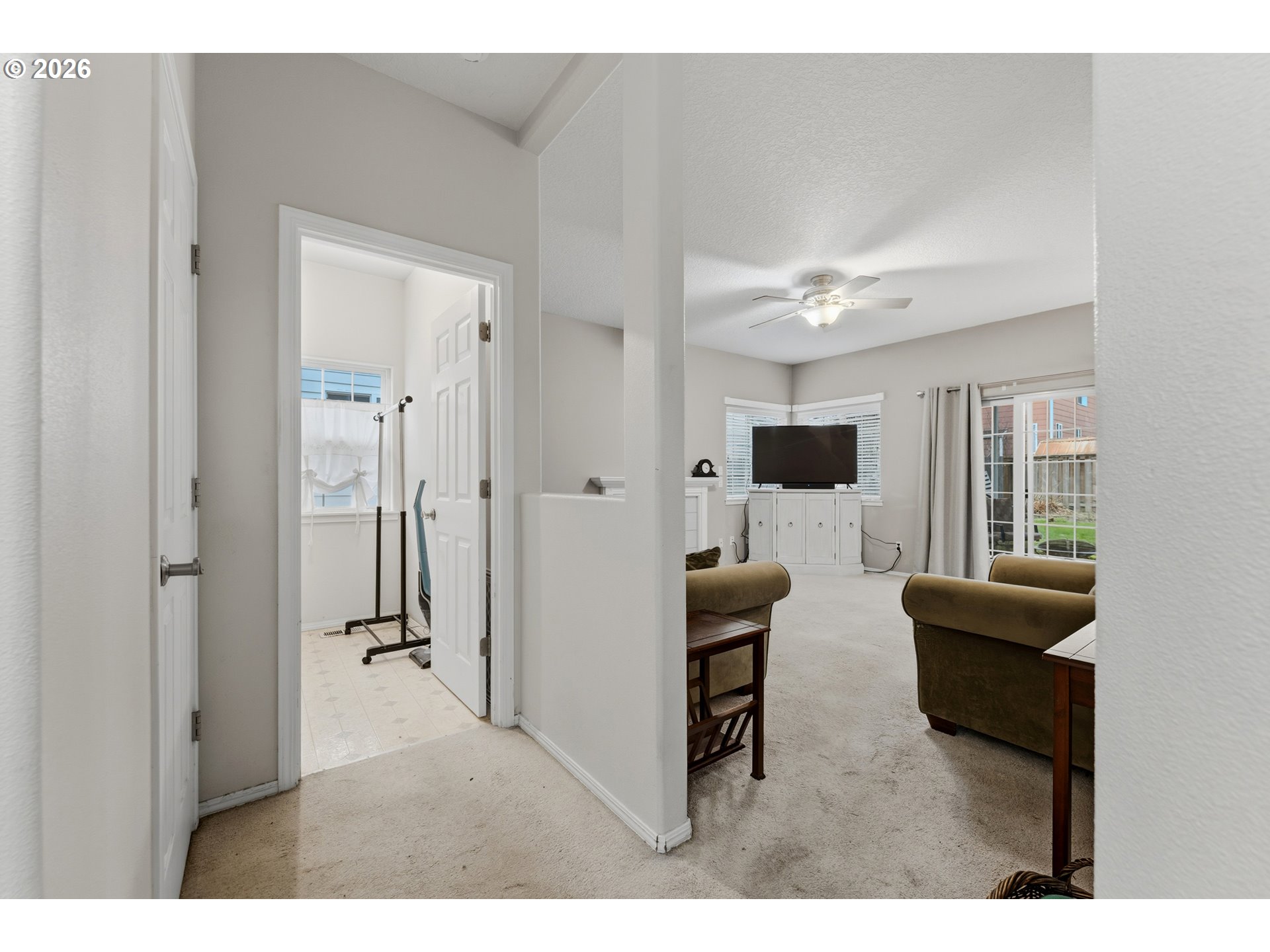 15852 Southeast Upman Way Damascus, OR 97089 - Photo 13 of 43 a living room with furniture and a flat screen tv