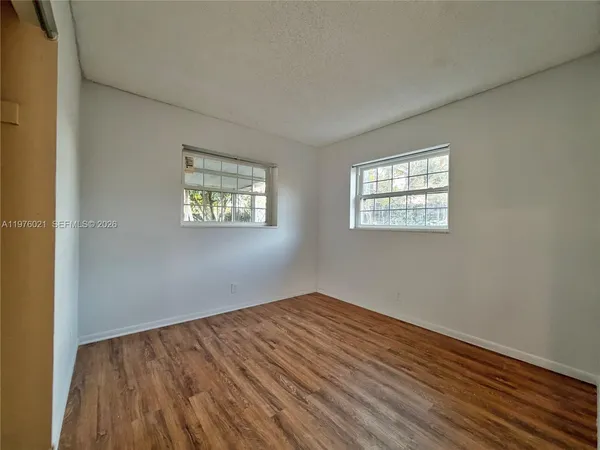 an empty room with windows