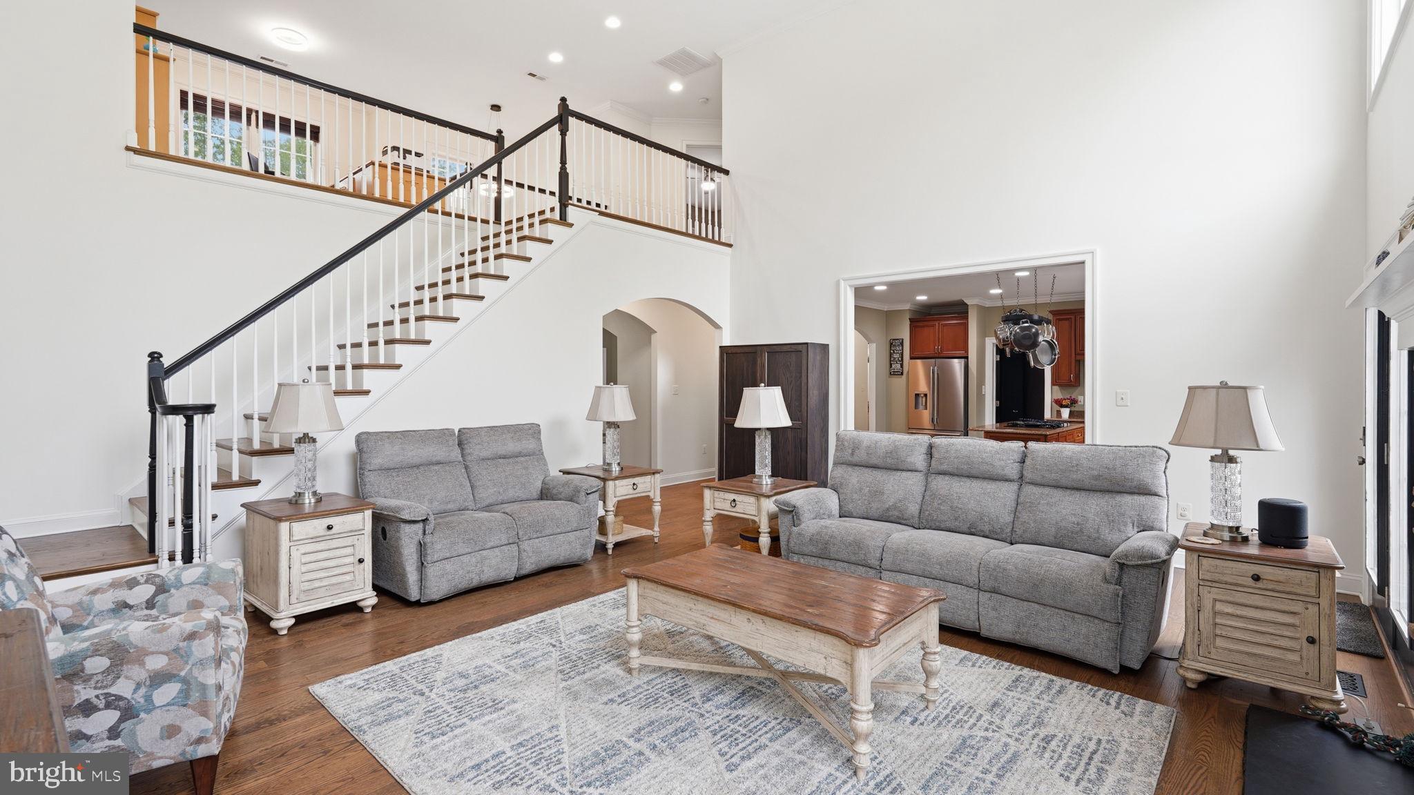 15613 Thoroughfare Road Gainesville, VA 20155 - Photo 18 of 63 a living room with furniture and a dining table