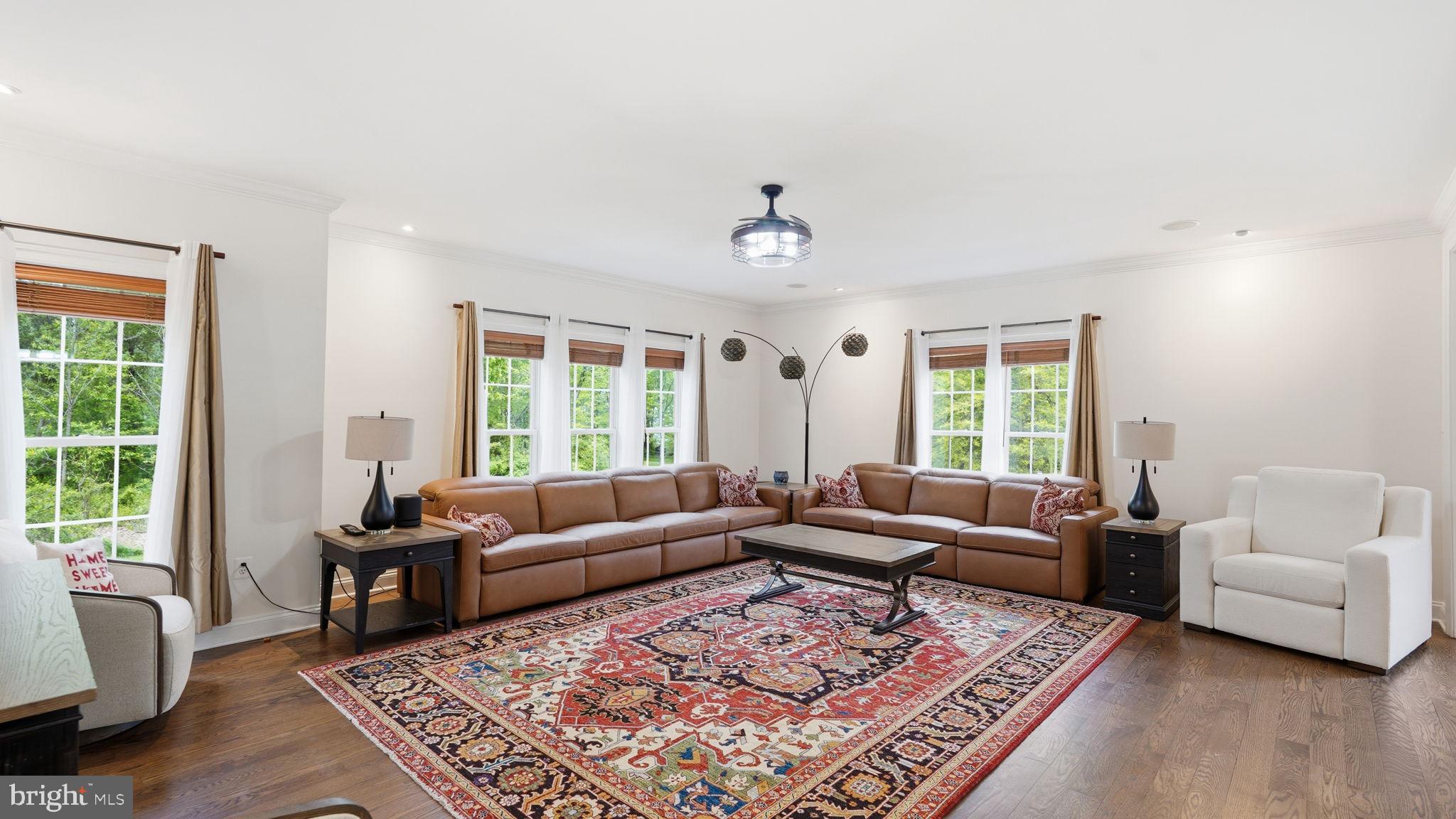 15613 Thoroughfare Road Gainesville, VA 20155 - Photo 20 of 63 a living room with furniture and a rug