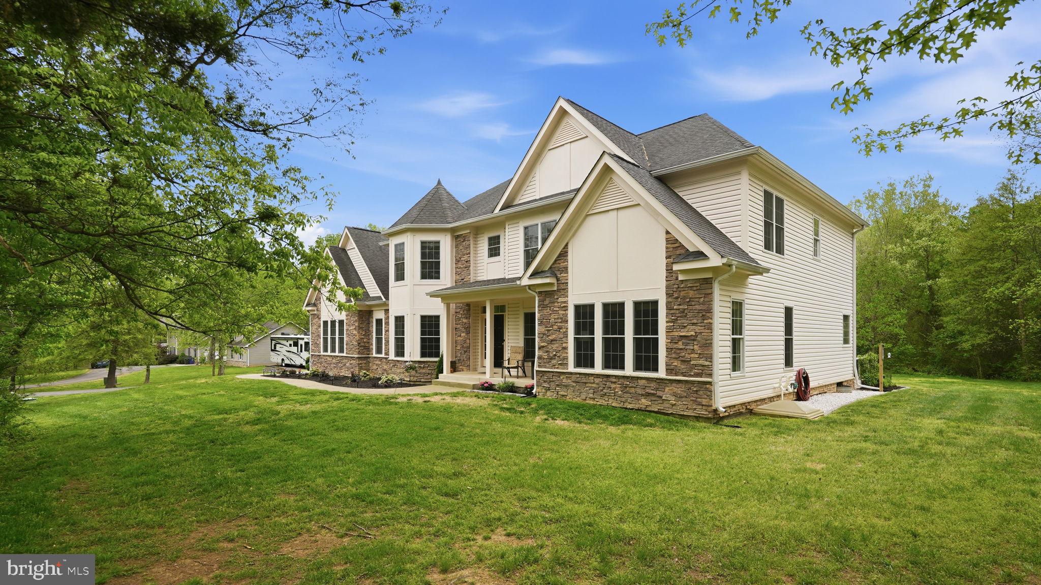15613 Thoroughfare Road Gainesville, VA 20155 - Photo 2 of 63 a front view of a house with a yard