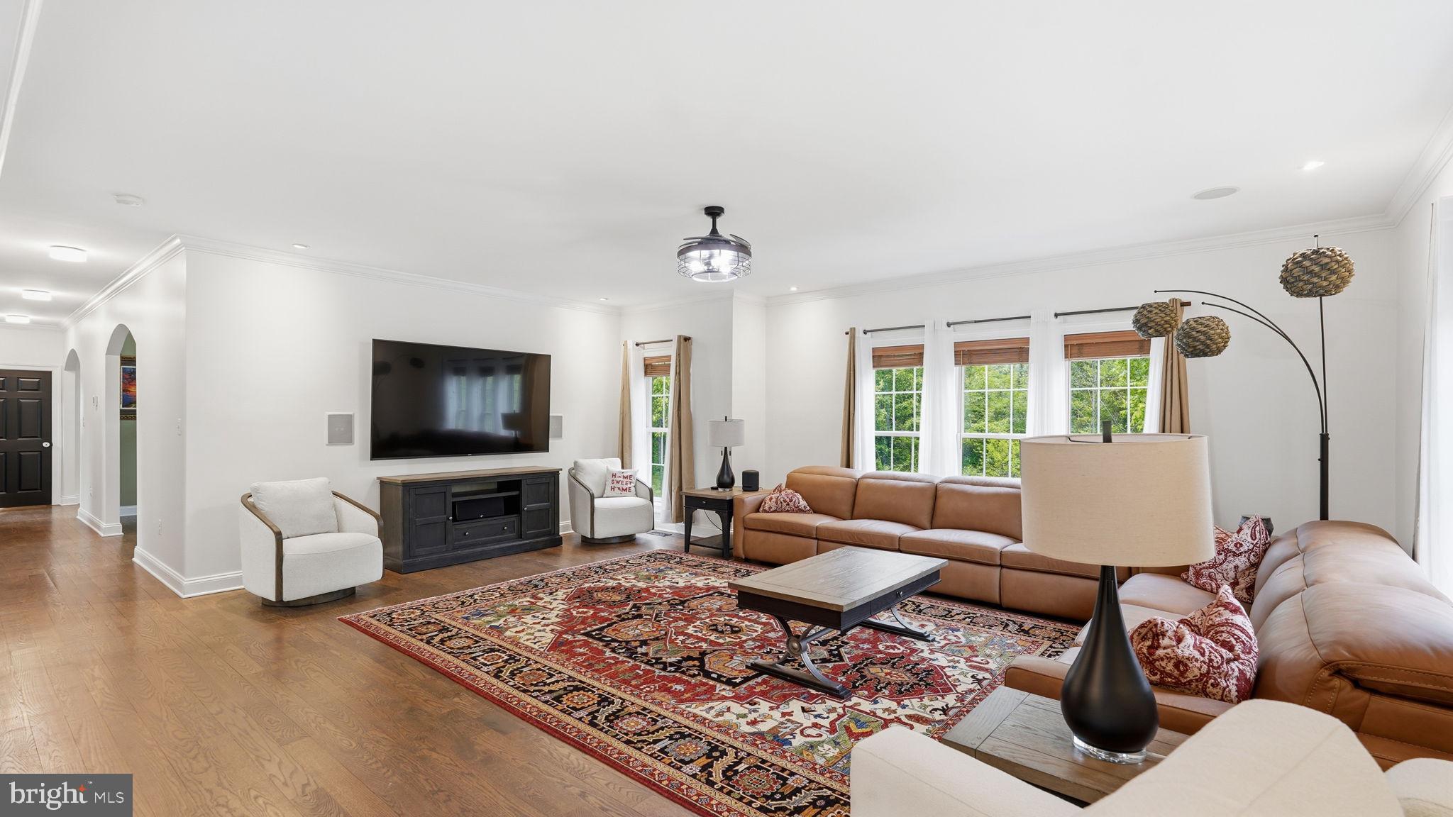 15613 Thoroughfare Road Gainesville, VA 20155 - Photo 21 of 63 a living room with furniture and a flat screen tv
