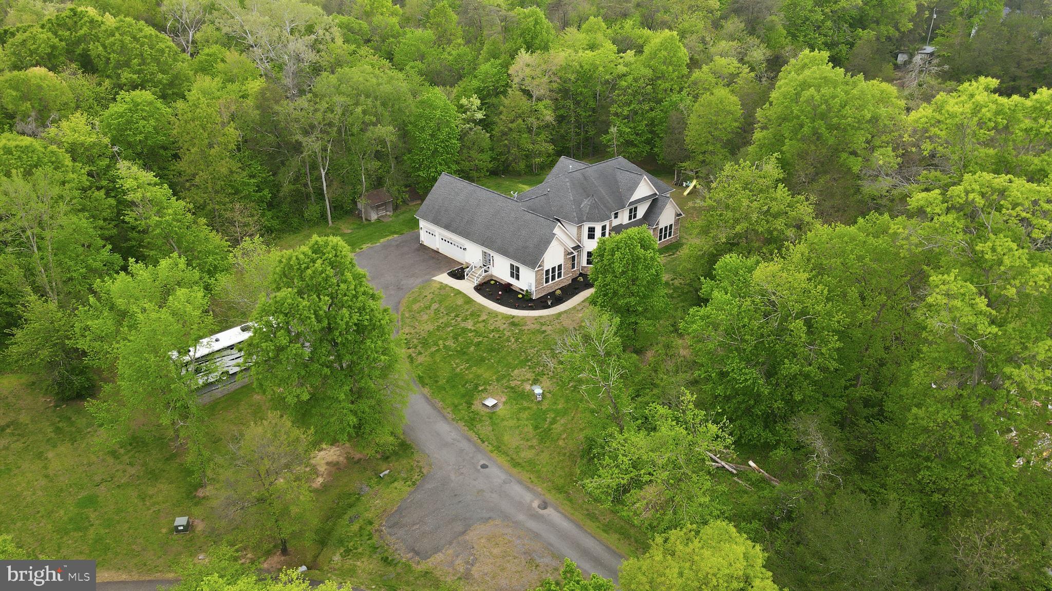 15613 Thoroughfare Road Gainesville, VA 20155 - Photo 3 of 63 Serene retreat nestled in lush greenery.