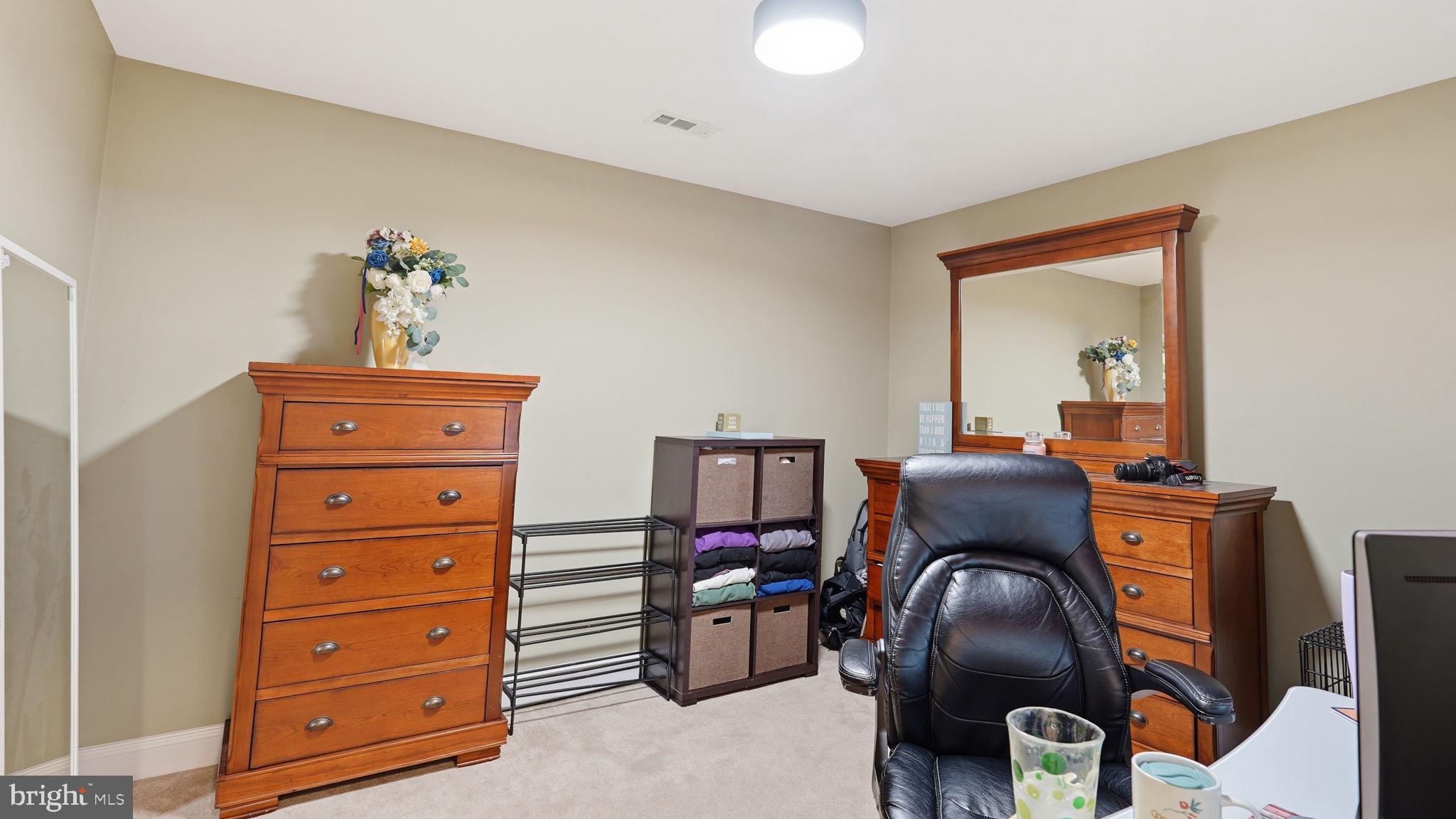 15613 Thoroughfare Road Gainesville, VA 20155 - Photo 33 of 63 Cozy workspace with warm tones.