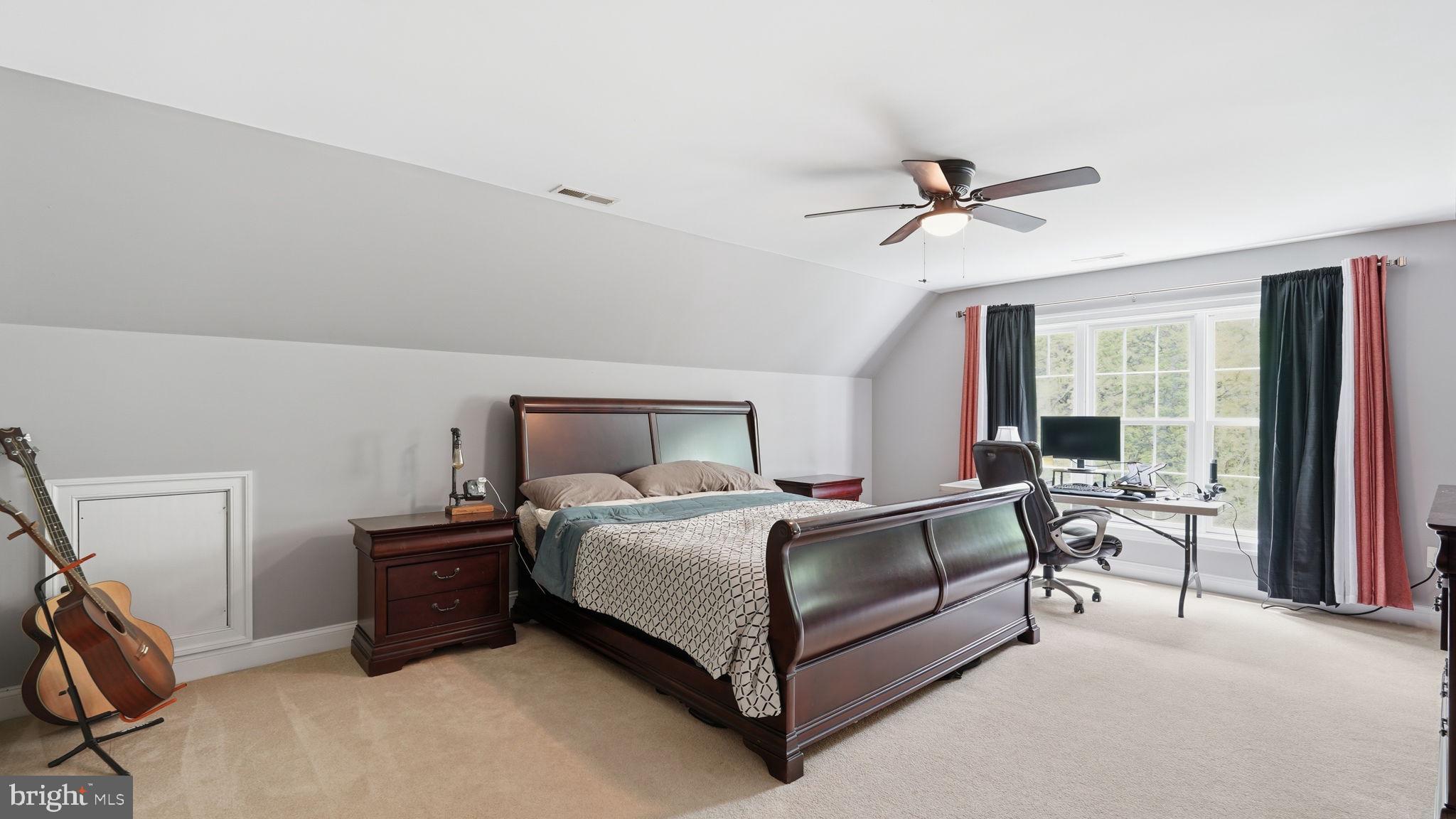 15613 Thoroughfare Road Gainesville, VA 20155 - Photo 39 of 63 a bedroom with a bed couch and a window